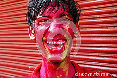 A boyâ€™s face smeared with colour. Stock Photo